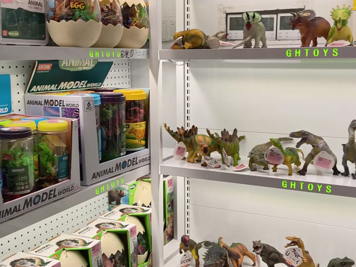 Dinosaur and animal toy figures on a Shantou showroom shelf